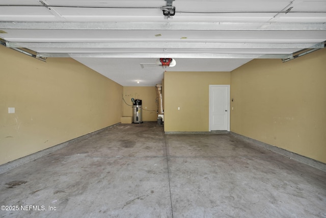 4431 Vista Point Ln, Orange Park, FL 32065 - garage featuring a garage door opener and heat pump water heater