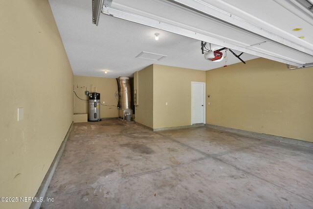 4431 Vista Point Ln, Orange Park, FL 32065 - garage featuring heat pump water heater and a garage door opener