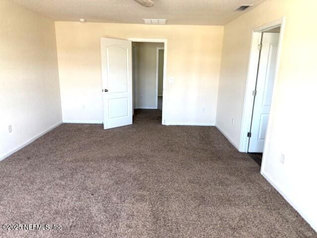 3432 Concord Ct, Green Cove Springs, FL 32043 - unfurnished room with dark carpet and baseboards