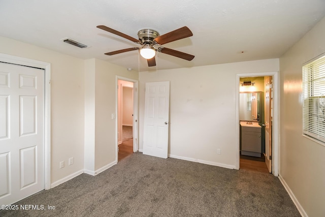 2415 Mill Creek Rd, Jacksonville, FL 32211 - unfurnished bedroom featuring carpet, connected bathroom, and ceiling fan