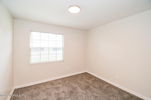 2415 Mill Creek Rd, Jacksonville, FL 32211 - carpeted spare room with baseboards