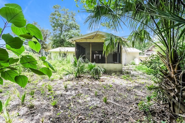 2415 Mill Creek Rd, Jacksonville, FL 32211 - view of home's exterior with a sunroom