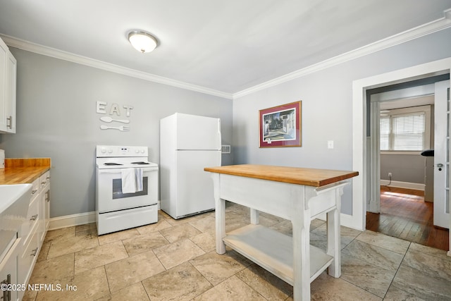 22 Marion St, Saint Augustine, FL 32084 - kitchen with white appliances, wooden counters, crown molding, and white cabinets