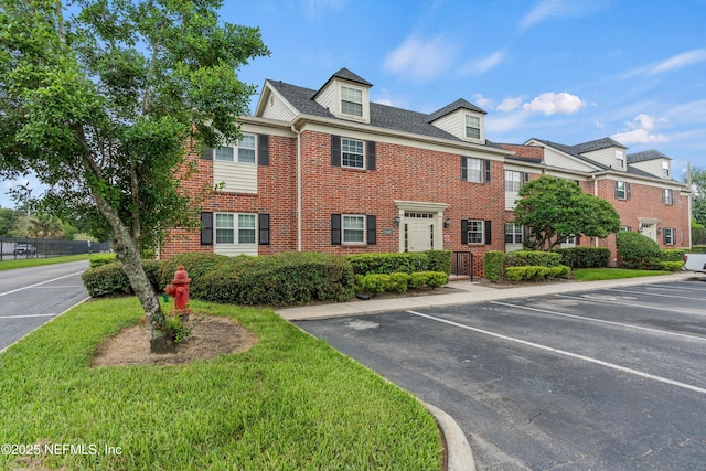 4915 Baymeadows Rd Unit 8B, Jacksonville, FL 32217 - townhome / multi-family property featuring brick siding and uncovered parking