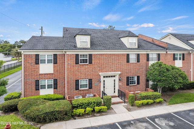 4915 Baymeadows Rd Unit 8B, Jacksonville, FL 32217 - multi unit property featuring uncovered parking, brick siding, and roof with shingles