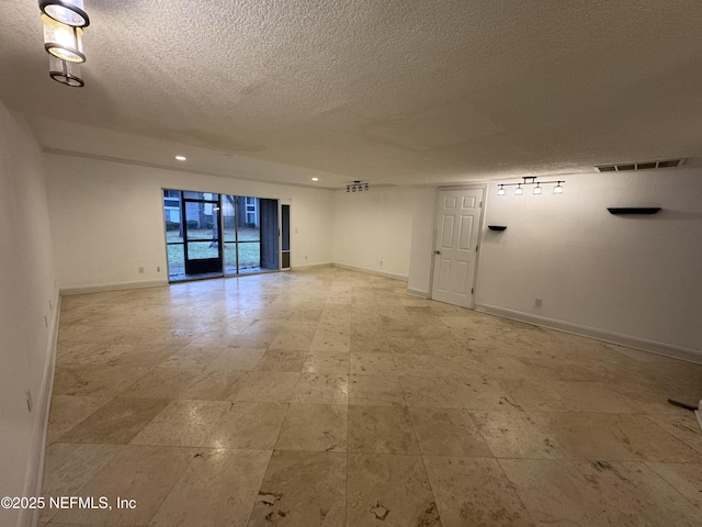 8880 Old Kings Rd S Unit 53, Jacksonville, FL 32257 - empty room with a textured ceiling and baseboards