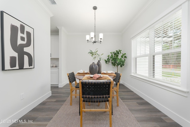 1114 Nantucket Ave, Jacksonville, FL 32233 - dining area with a chandelier, ornamental molding, and dark wood finished floors