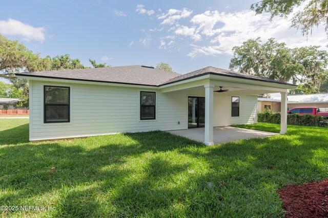 1114 Nantucket Ave, Jacksonville, FL 32233 - rear view of property featuring a patio, a lawn, and a shingled roof