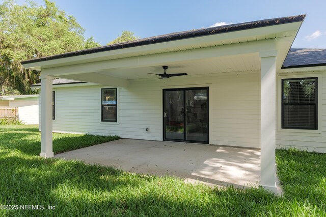 1114 Nantucket Ave, Jacksonville, FL 32233 - back of property with a ceiling fan, a yard, a patio area, and roof with shingles