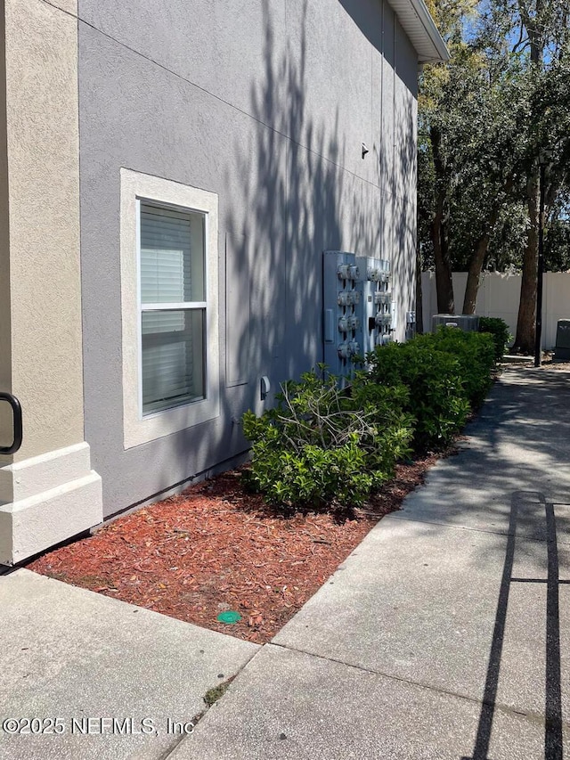 5151 Playpen Dr Unit 7-2, Jacksonville, FL 32210 - view of property exterior with stucco siding