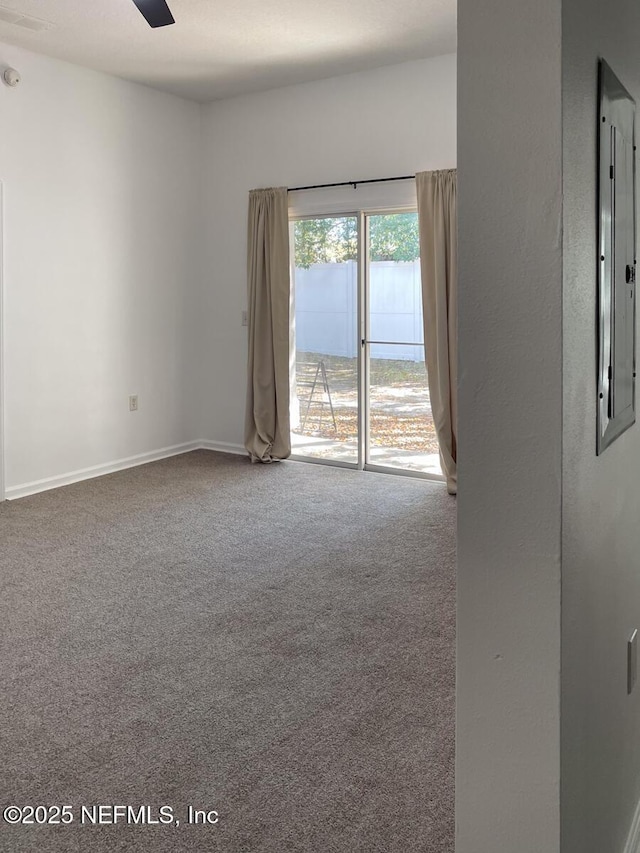 5151 Playpen Dr Unit 7-2, Jacksonville, FL 32210 - empty room with carpet, electric panel, and a ceiling fan