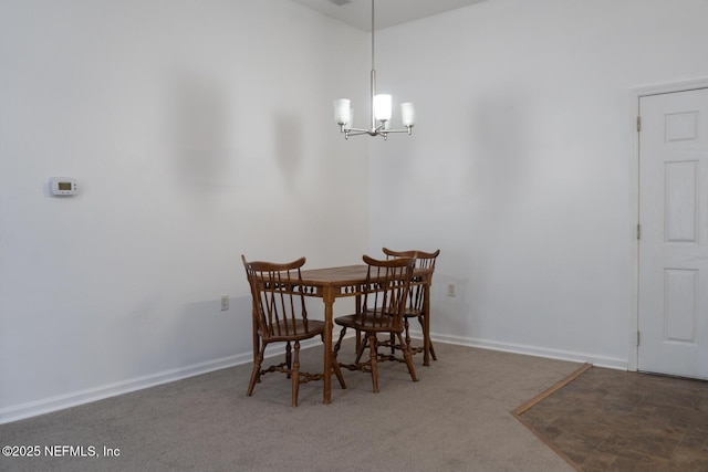 5151 Playpen Dr Unit 7-2, Jacksonville, FL 32210 - carpeted dining space with a chandelier and baseboards
