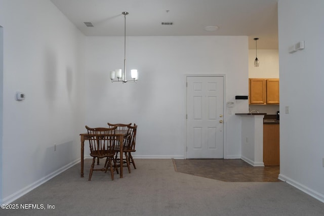 5151 Playpen Dr Unit 7-2, Jacksonville, FL 32210 - carpeted dining room featuring a chandelier and baseboards