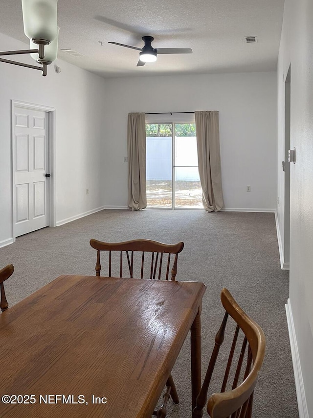 5151 Playpen Dr Unit 7-2, Jacksonville, FL 32210 - dining space featuring a ceiling fan, carpet flooring, and a textured ceiling