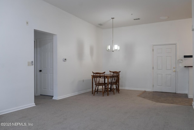 5151 Playpen Dr Unit 7-2, Jacksonville, FL 32210 - carpeted dining room with a chandelier and baseboards