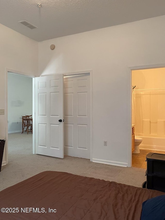 5151 Playpen Dr Unit 7-2, Jacksonville, FL 32210 - unfurnished bedroom with light colored carpet, a closet, and ensuite bath