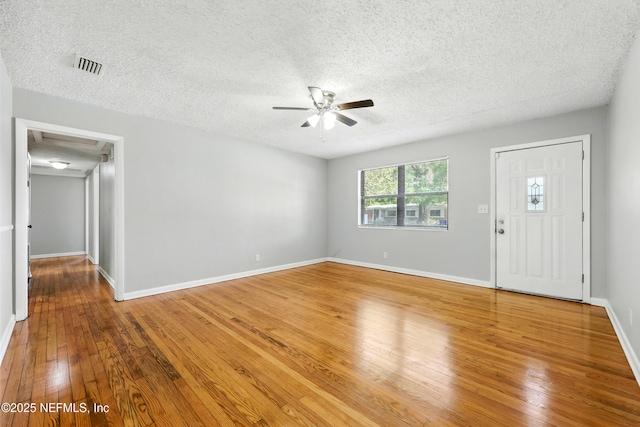 6552 Shady Oak Dr, Jacksonville, FL 32277 - entryway featuring a ceiling fan, a textured ceiling, and hardwood / wood-style floors