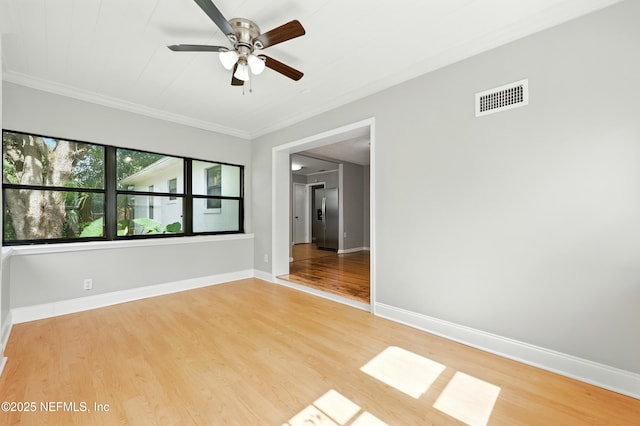 6552 Shady Oak Dr, Jacksonville, FL 32277 - empty room featuring a ceiling fan, wood finished floors, and crown molding