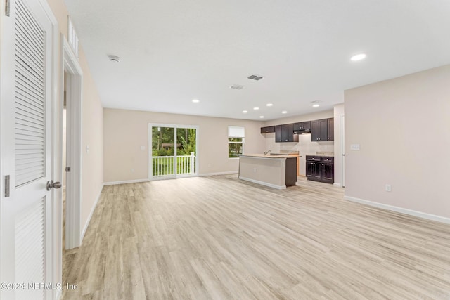 5428 Chenango Blvd, Jacksonville, FL 32254 - unfurnished living room featuring light wood-style flooring and recessed lighting