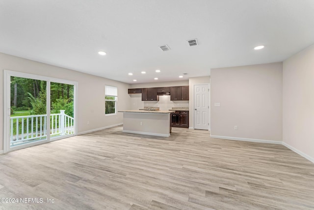 5428 Chenango Blvd, Jacksonville, FL 32254 - unfurnished living room featuring light wood-style floors and recessed lighting