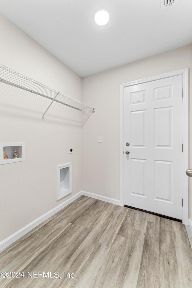 5428 Chenango Blvd, Jacksonville, FL 32254 - laundry room featuring washer hookup, light wood-style floors, and hookup for an electric dryer
