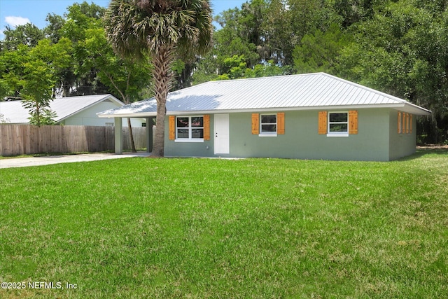 110 Pleasant Dr, East Palatka, FL 32131 - ranch-style home featuring stucco siding, driveway, a metal roof, and an attached carport