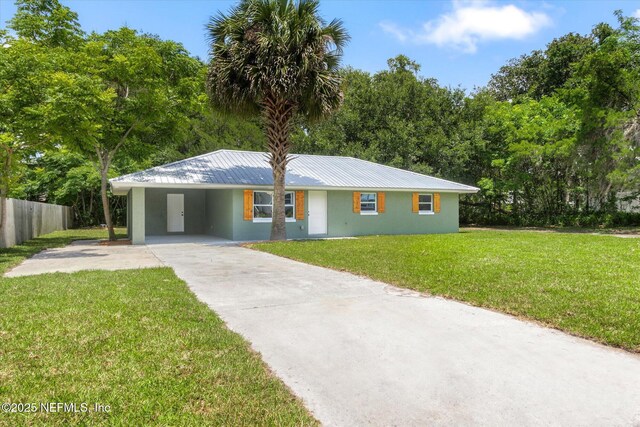 110 Pleasant Dr, East Palatka, FL 32131 - ranch-style home with driveway, a metal roof, a carport, and stucco siding