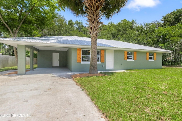 110 Pleasant Dr, East Palatka, FL 32131 - single story home featuring concrete driveway, stucco siding, a carport, and a metal roof