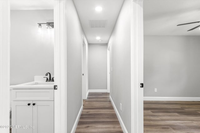 110 Pleasant Dr, East Palatka, FL 32131 - corridor with dark wood-style flooring and recessed lighting