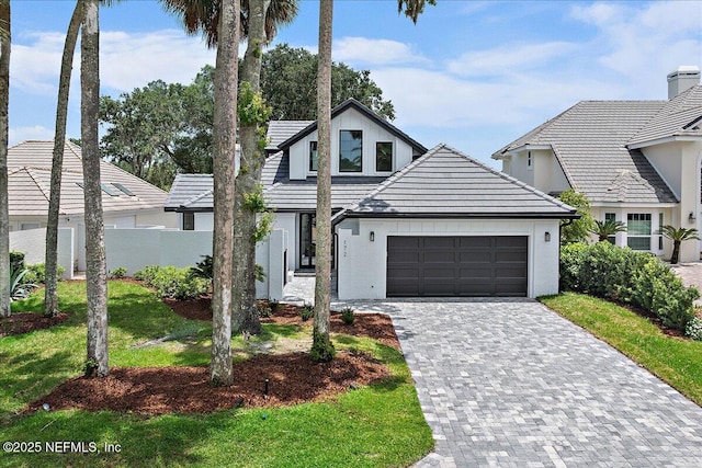 172 Laurel Ln, Ponte Vedra Beach, FL 32082 - view of front of property featuring stucco siding, a garage, decorative driveway, and a tile roof