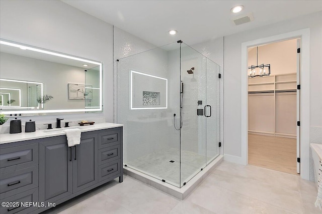 172 Laurel Ln, Ponte Vedra Beach, FL 32082 - full bath featuring vanity, a stall shower, a walk in closet, tile patterned floors, and recessed lighting