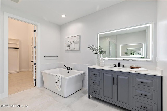 172 Laurel Ln, Ponte Vedra Beach, FL 32082 - bathroom featuring a spacious closet, a freestanding bath, vanity, a shower with door, and tile patterned floors