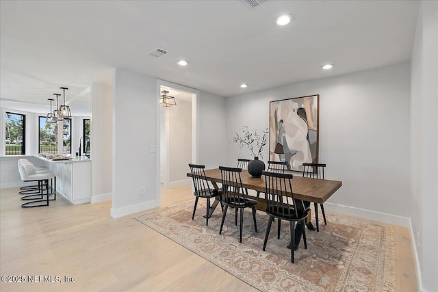 172 Laurel Ln, Ponte Vedra Beach, FL 32082 - dining area with light wood-style floors, recessed lighting, and a chandelier