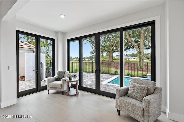 172 Laurel Ln, Ponte Vedra Beach, FL 32082 - sitting room featuring french doors, wood finished floors, and recessed lighting