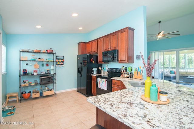11890 Surfbird Cir Unit 42E, Jacksonville, FL 32256 - kitchen featuring black appliances, ceiling fan, light stone counters, brown cabinets, and recessed lighting