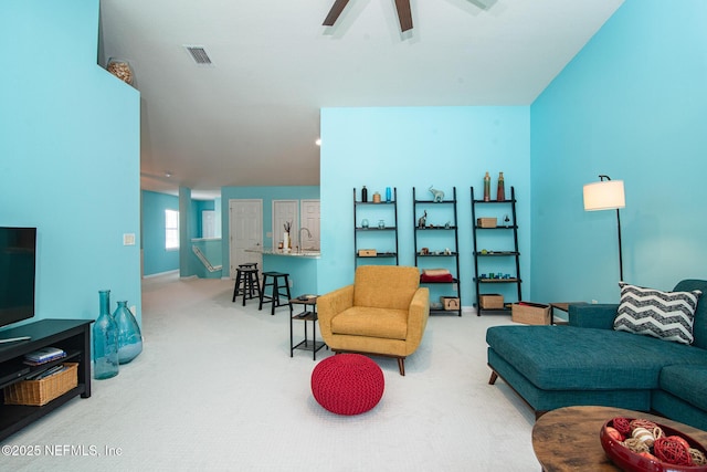 11890 Surfbird Cir Unit 42E, Jacksonville, FL 32256 - living area featuring carpet floors and ceiling fan