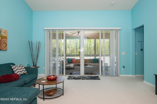 11890 Surfbird Cir Unit 42E, Jacksonville, FL 32256 - carpeted living room with ceiling fan and baseboards