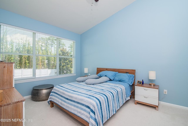 11890 Surfbird Cir Unit 42E, Jacksonville, FL 32256 - bedroom featuring carpet, multiple windows, vaulted ceiling, and ceiling fan
