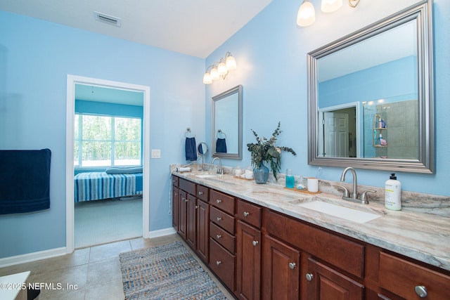 11890 Surfbird Cir Unit 42E, Jacksonville, FL 32256 - full bath featuring double vanity, tile patterned flooring, and ensuite bath