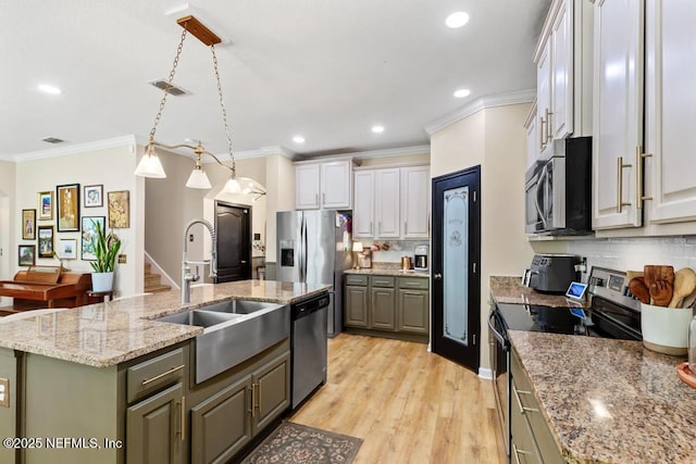 190 Colorado Springs Way, Saint Augustine, FL 32092 - kitchen with stainless steel appliances, a kitchen island with sink, decorative backsplash, crown molding, and recessed lighting