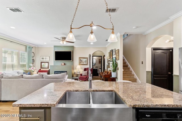 190 Colorado Springs Way, Saint Augustine, FL 32092 - kitchen with ceiling fan, arched walkways, crown molding, light stone countertops, and open floor plan