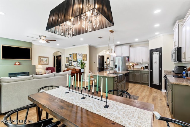 190 Colorado Springs Way, Saint Augustine, FL 32092 - dining area featuring ceiling fan, light wood finished floors, ornamental molding, arched walkways, and recessed lighting