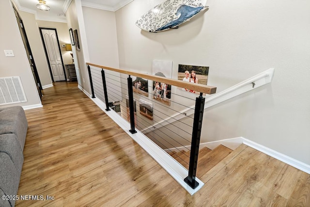 190 Colorado Springs Way, Saint Augustine, FL 32092 - hall with an upstairs landing, crown molding, and wood finished floors