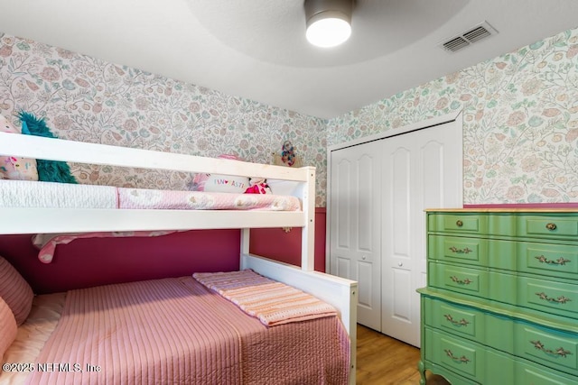 190 Colorado Springs Way, Saint Augustine, FL 32092 - bedroom featuring wallpapered walls, a closet, wood finished floors, and a ceiling fan
