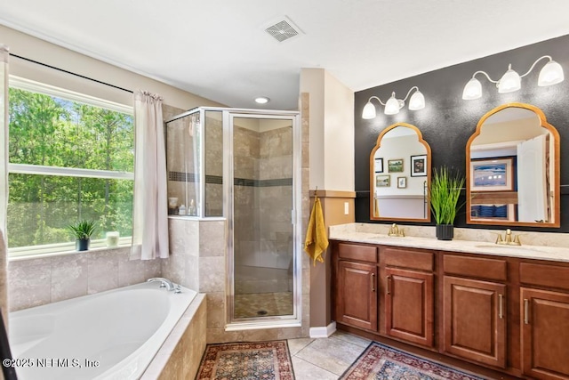 190 Colorado Springs Way, Saint Augustine, FL 32092 - bathroom featuring a shower stall, a garden tub, double vanity, and tile patterned flooring