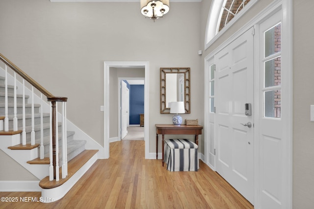 101 Royal Lagoon Ct, Ponte Vedra Beach, FL 32082 - foyer entrance featuring stairway, light wood finished floors, and a towering ceiling