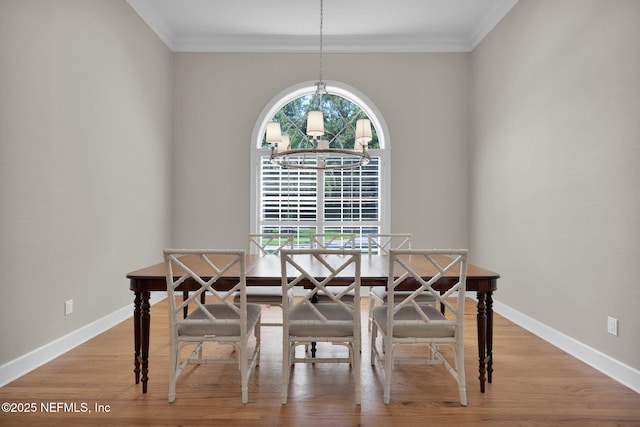 101 Royal Lagoon Ct, Ponte Vedra Beach, FL 32082 - dining space with a chandelier, crown molding, and wood finished floors