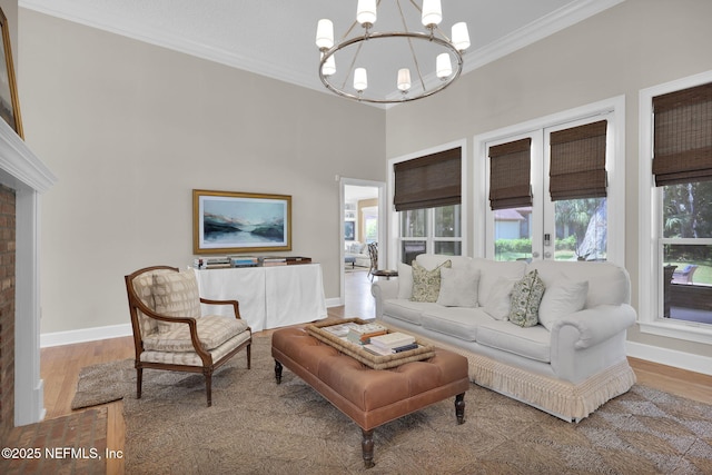 101 Royal Lagoon Ct, Ponte Vedra Beach, FL 32082 - living room featuring a chandelier, crown molding, and wood finished floors