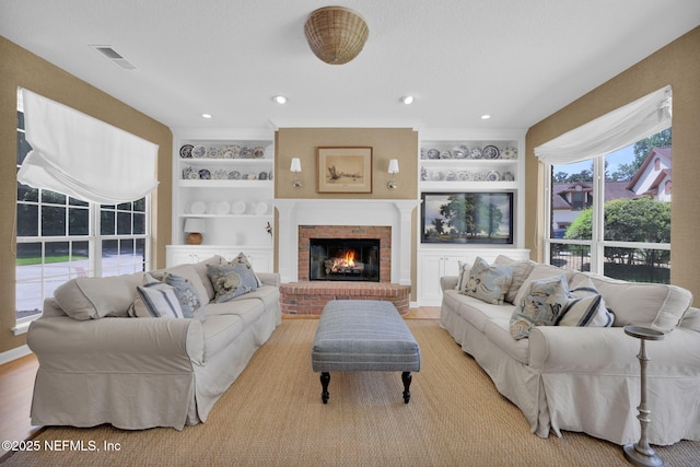101 Royal Lagoon Ct, Ponte Vedra Beach, FL 32082 - living room featuring built in shelves and a brick fireplace