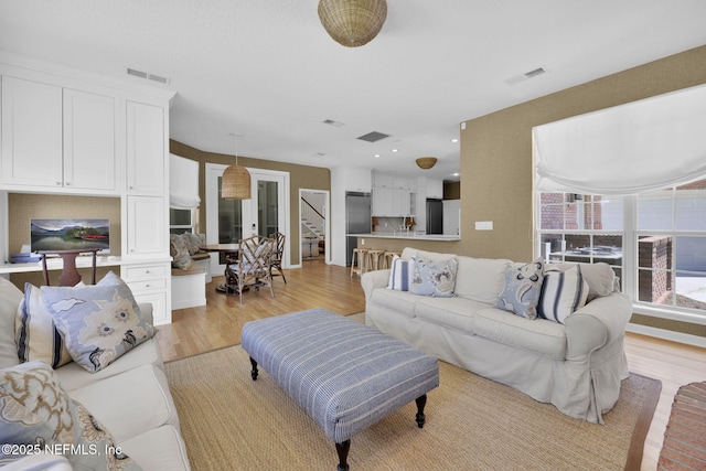101 Royal Lagoon Ct, Ponte Vedra Beach, FL 32082 - living room with light wood-type flooring and stairway